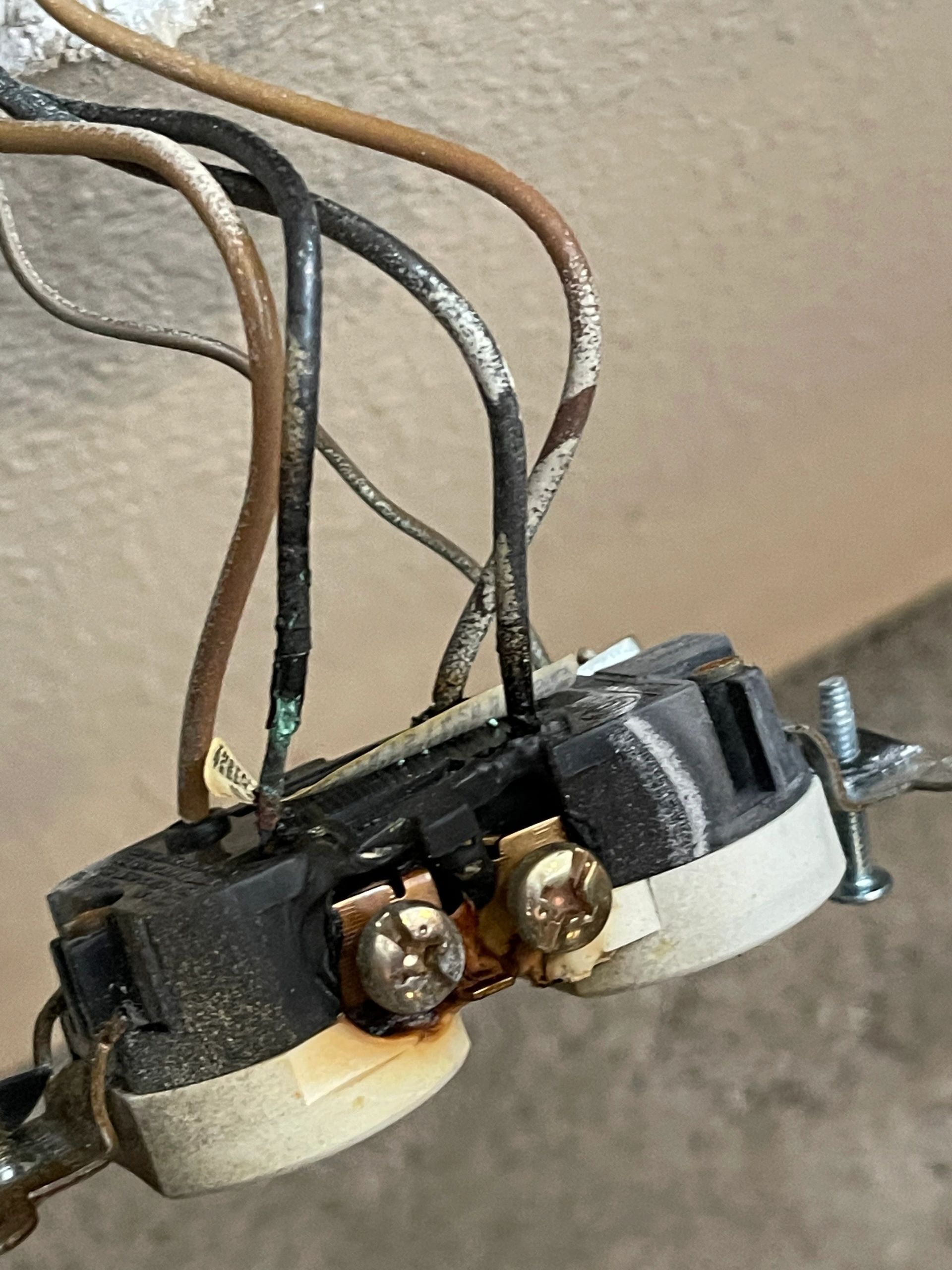 Heat-damaged electrical receptacle and wiring found during troubleshooting